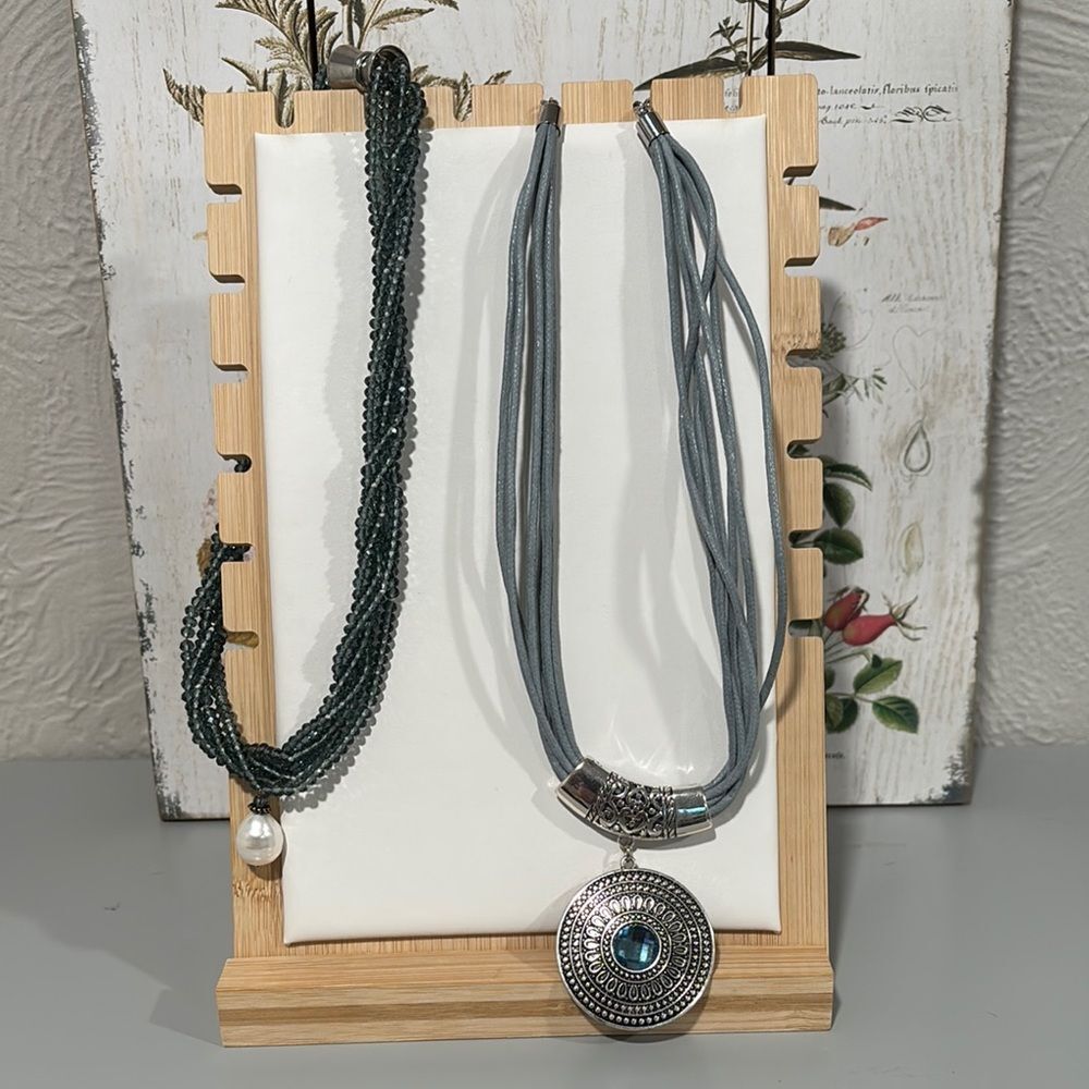 Facested blue crystal necklace and blue corded medallion necklace